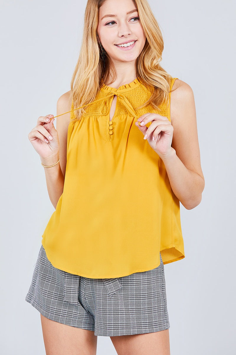 Sleeveless Ruffle Neck W/self Tie Smocked Yoke Detail Front Button Woven Top