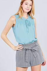 Sleeveless Ruffle Neck W/self Tie Smocked Yoke Detail Front Button Woven Top