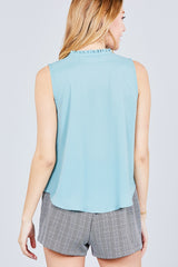 Sleeveless Ruffle Neck W/self Tie Smocked Yoke Detail Front Button Woven Top