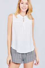 Sleeveless Ruffle Neck W/self Tie Smocked Yoke Detail Front Button Woven Top