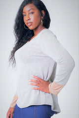 Solid, Waist Length Long Sleeve Top In A Relaxed Style With A Round Neck And Faux Suede Contrast Wrist Cuff.