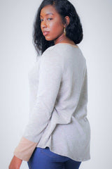 Solid, Waist Length Long Sleeve Top In A Relaxed Style With A Round Neck And Faux Suede Contrast Wrist Cuff.